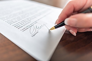a-negotiation-being-signed-by-a-government-contractor